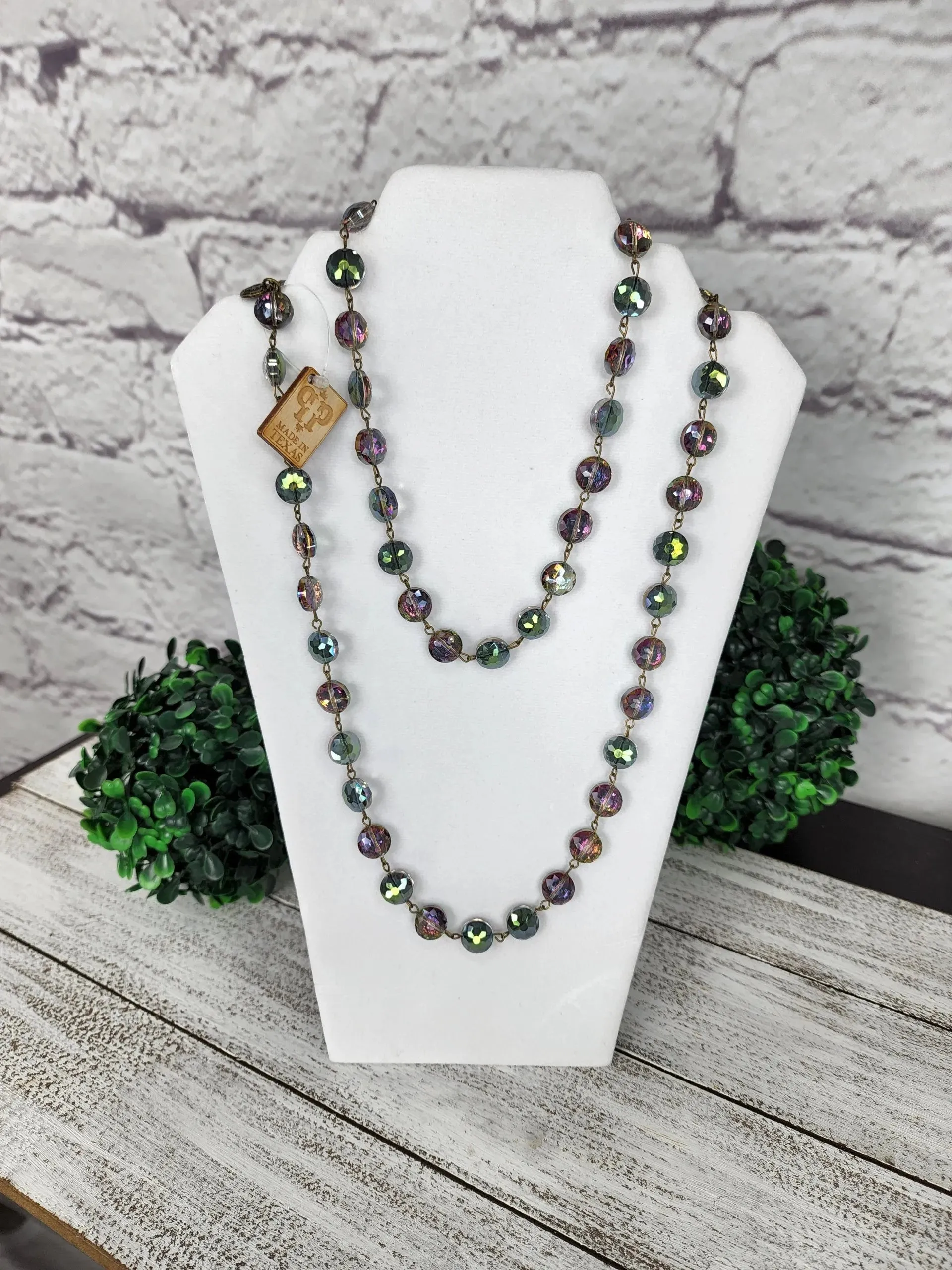 Faceted crystal on bronze wire necklace